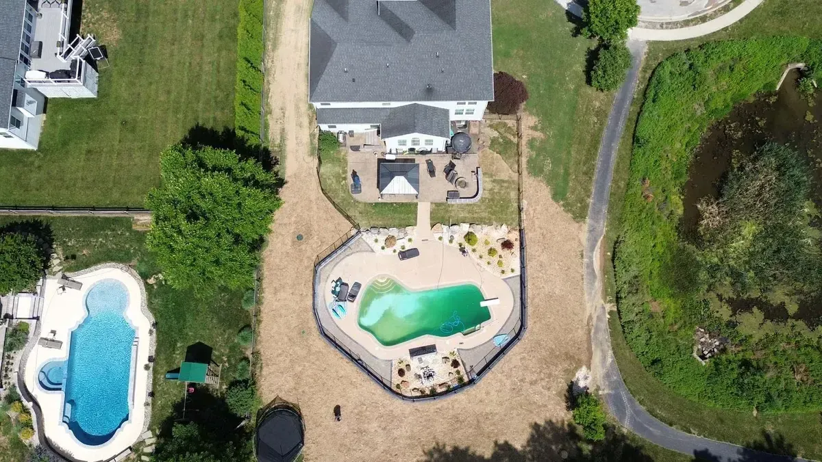 Aerial estate view with freeform pool paver patio and gazebo in Chester County PA