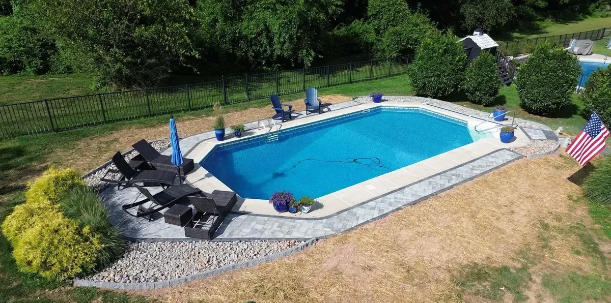 Rectangular pool with paver coping and Adirondack lounge area in Chester County PA